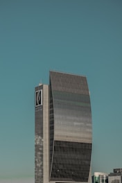 a tall building with a clock on the side of it