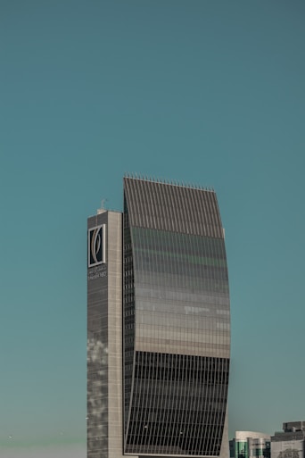 a tall building with a clock on the side of it