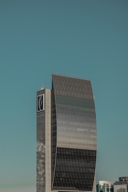 a tall building with a clock on the side of it