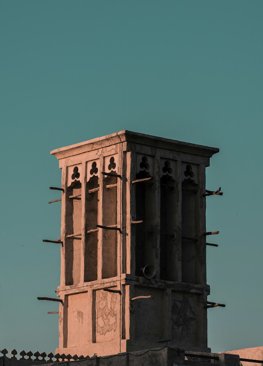 a tall tower with a clock on the top of it