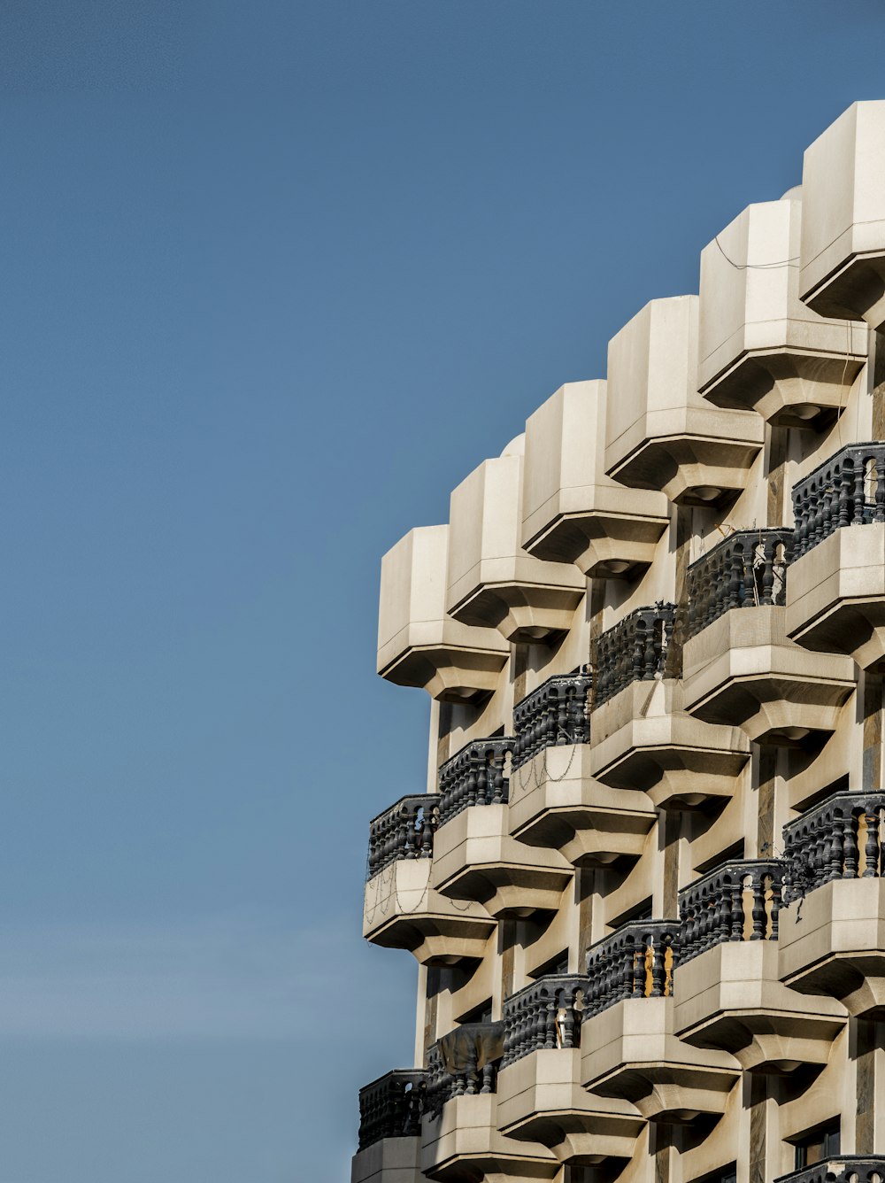 a tall building with balconies and balconies on the balconies