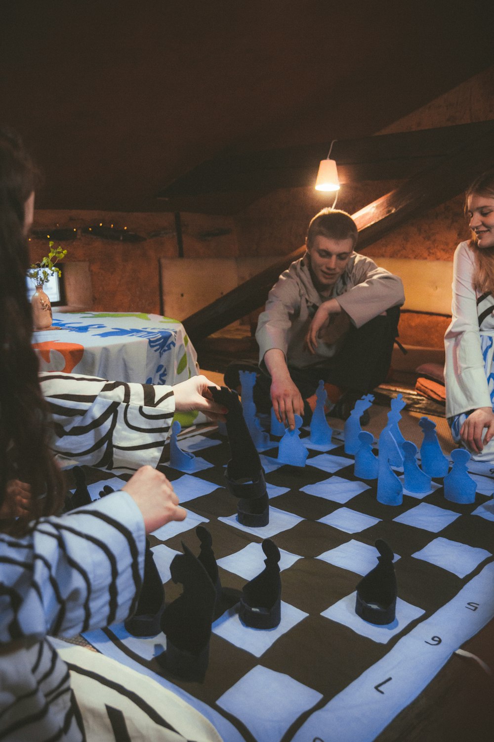 a group of people playing a game of chess