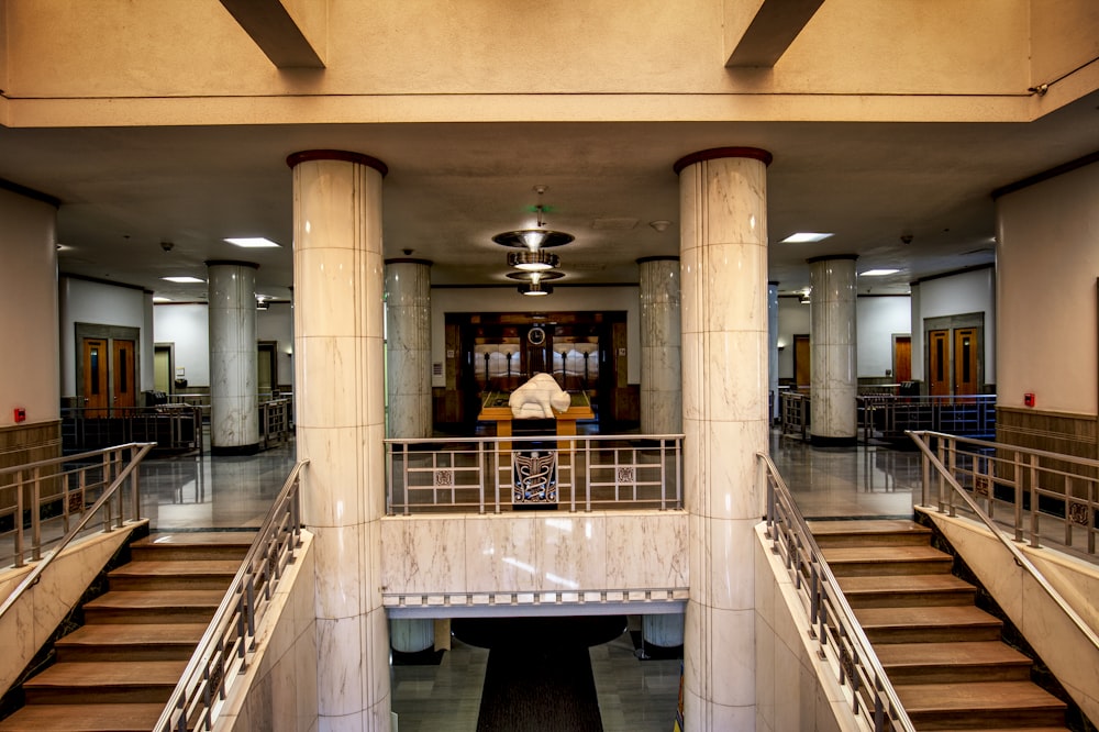 a large building with a bunch of stairs and a clock