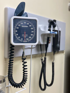 a wall mounted meter and a phone hooked up to it
