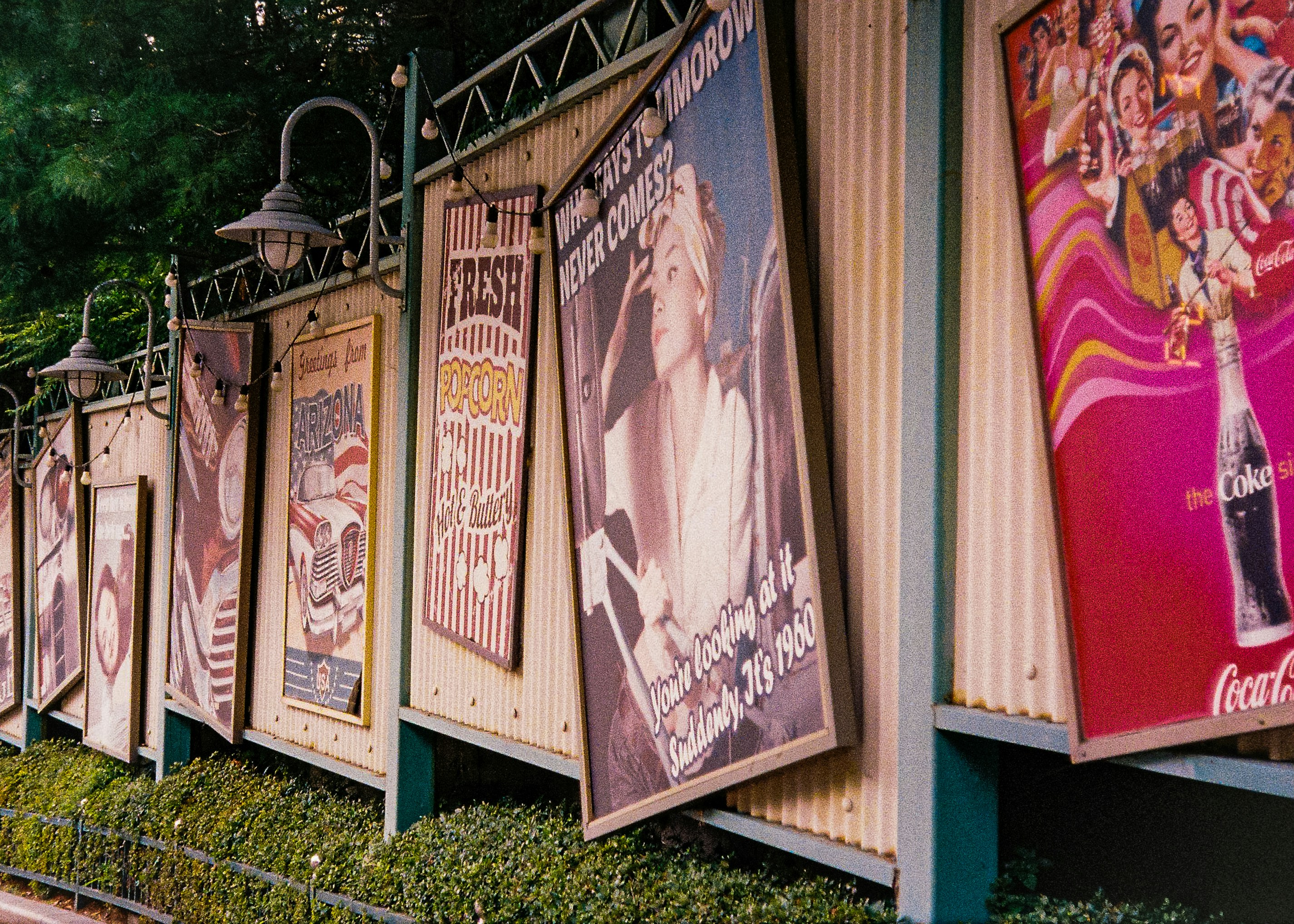 a row of posters on the side of a building