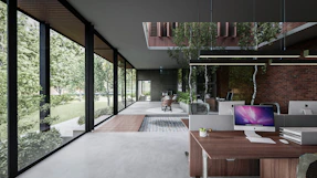 Transparent glass partitions dividing office spaces with natural light streaming through.