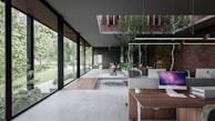 Modern office space with natural light and plants, emphasizing a remote-first culture.