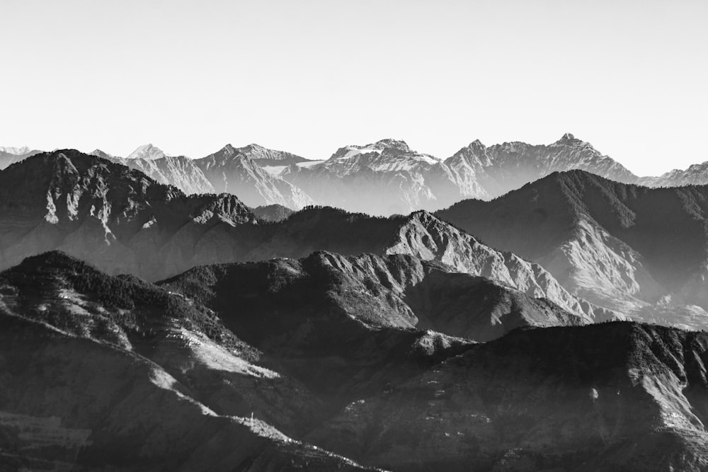 a black and white photo of a mountain range