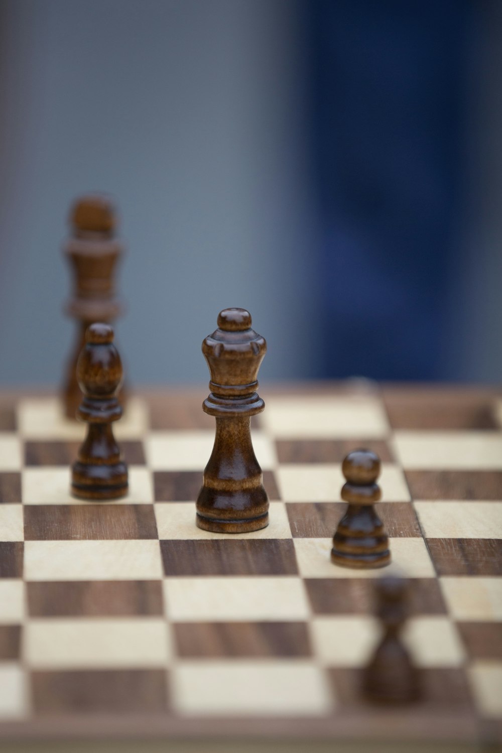 a close up of a chess board with pieces on it