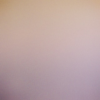 Soft fade transition between ivory and burnt amber tones with a hint of slate accents