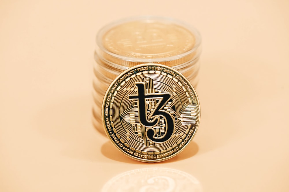 a stack of coins sitting on top of a table