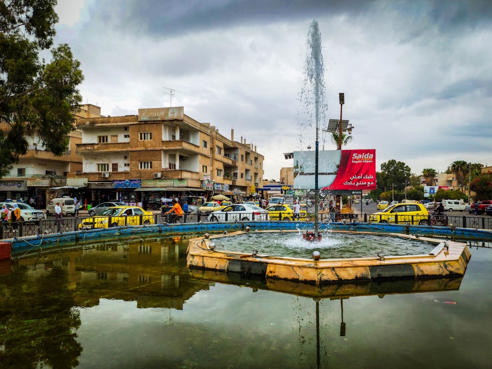 a fountain in the middle of a city square