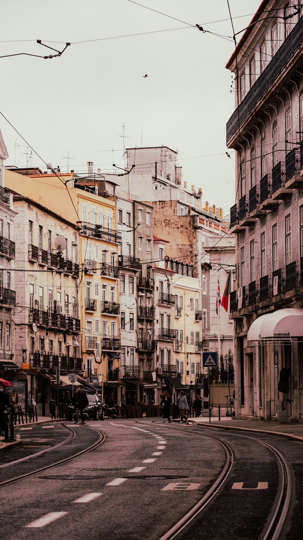 a city street filled with lots of tall buildings