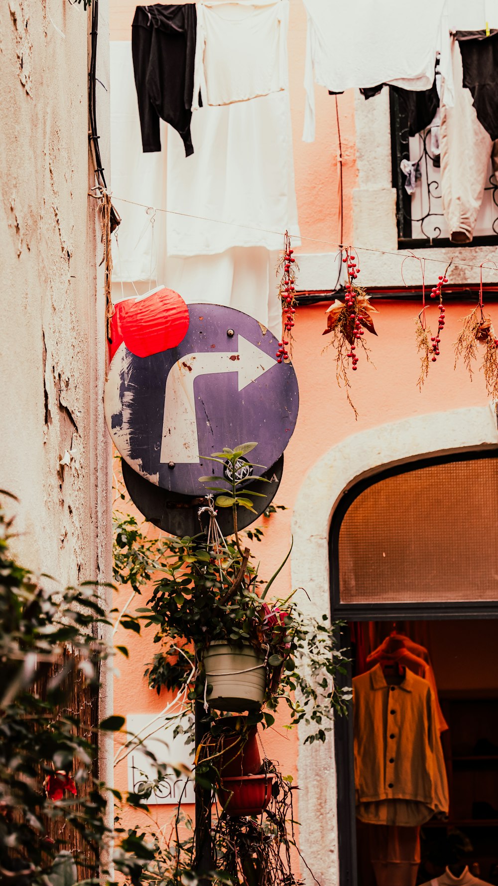 a street sign hanging from the side of a building