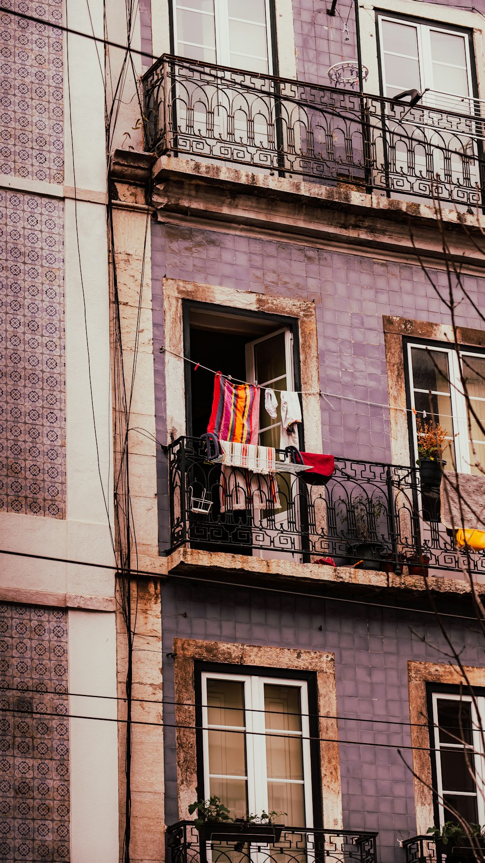 an apartment building with a balcony and balconies