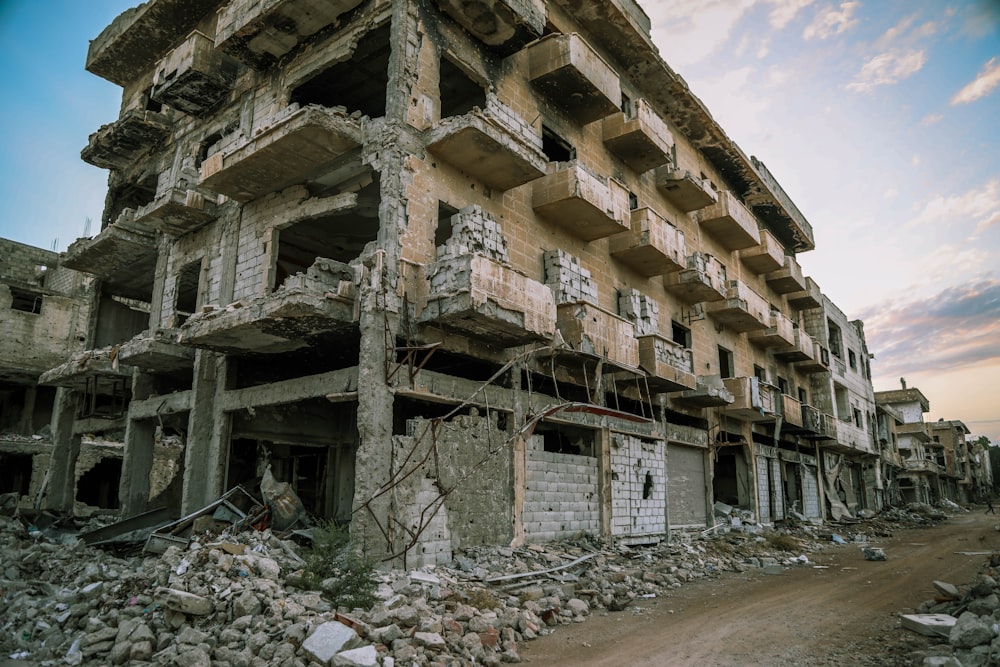 a building that has been demolished with rubble on the ground