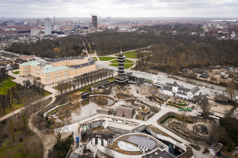 an aerial view of a city with a large building