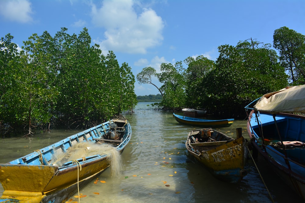 a group of boats floating on top of a river