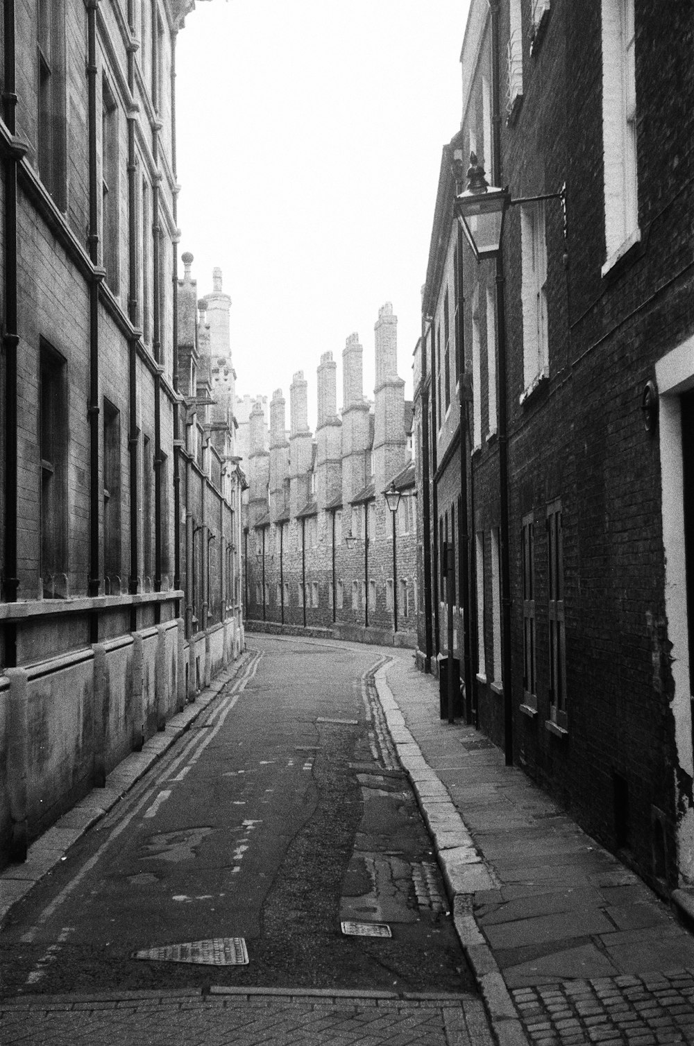 a black and white photo of an empty street