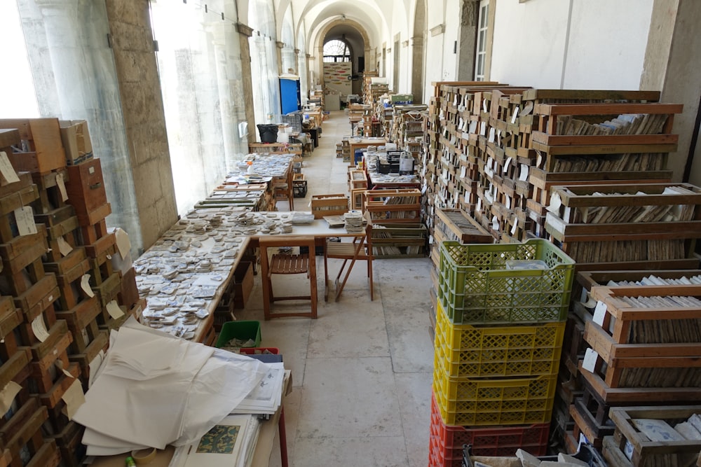 a room filled with lots of wooden boxes