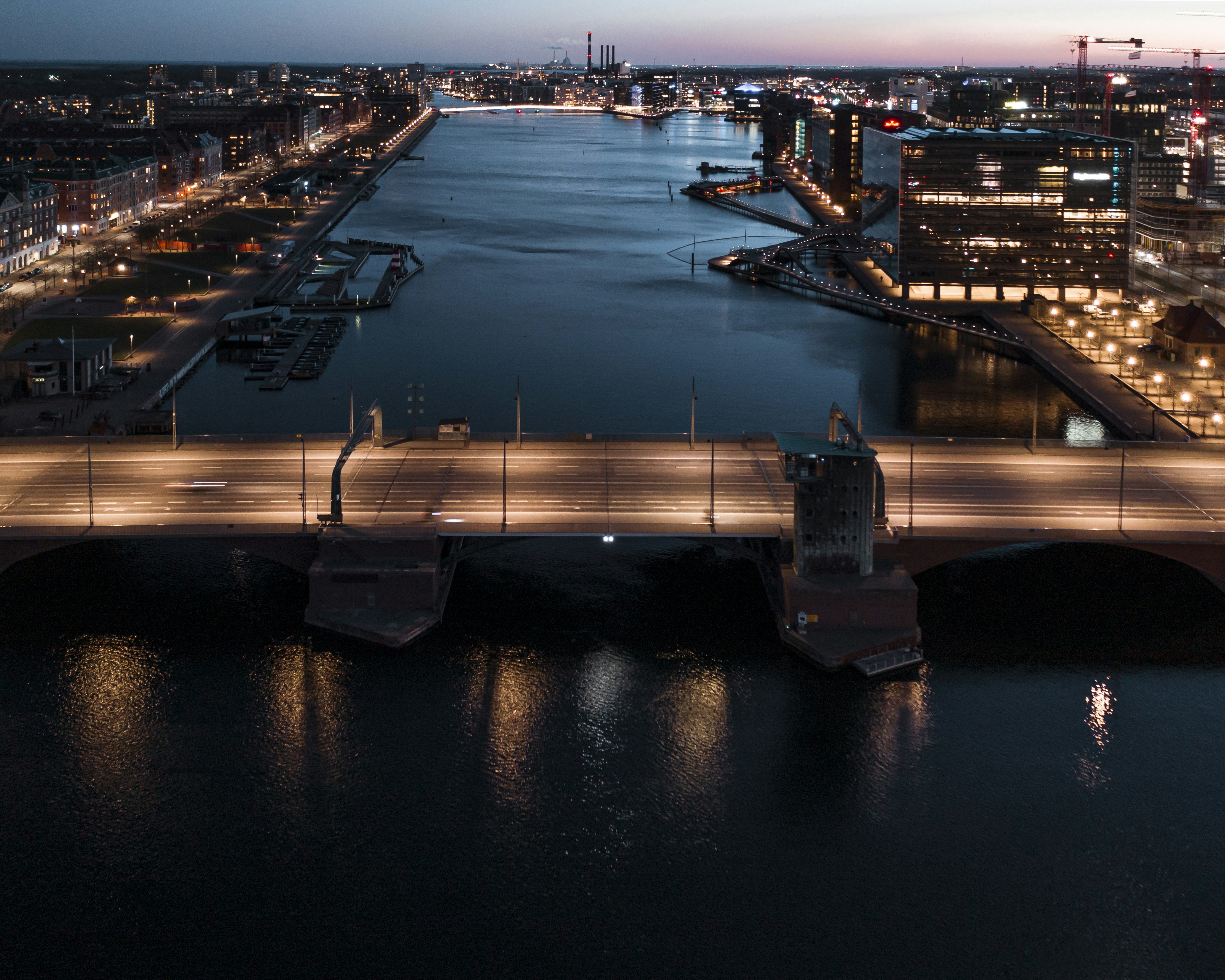 a bridge over a body of water at night, Langebro, Copenhagen · March 2020