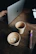 A thoughtful person typing feedback on a laptop with a cup of coffee nearby.