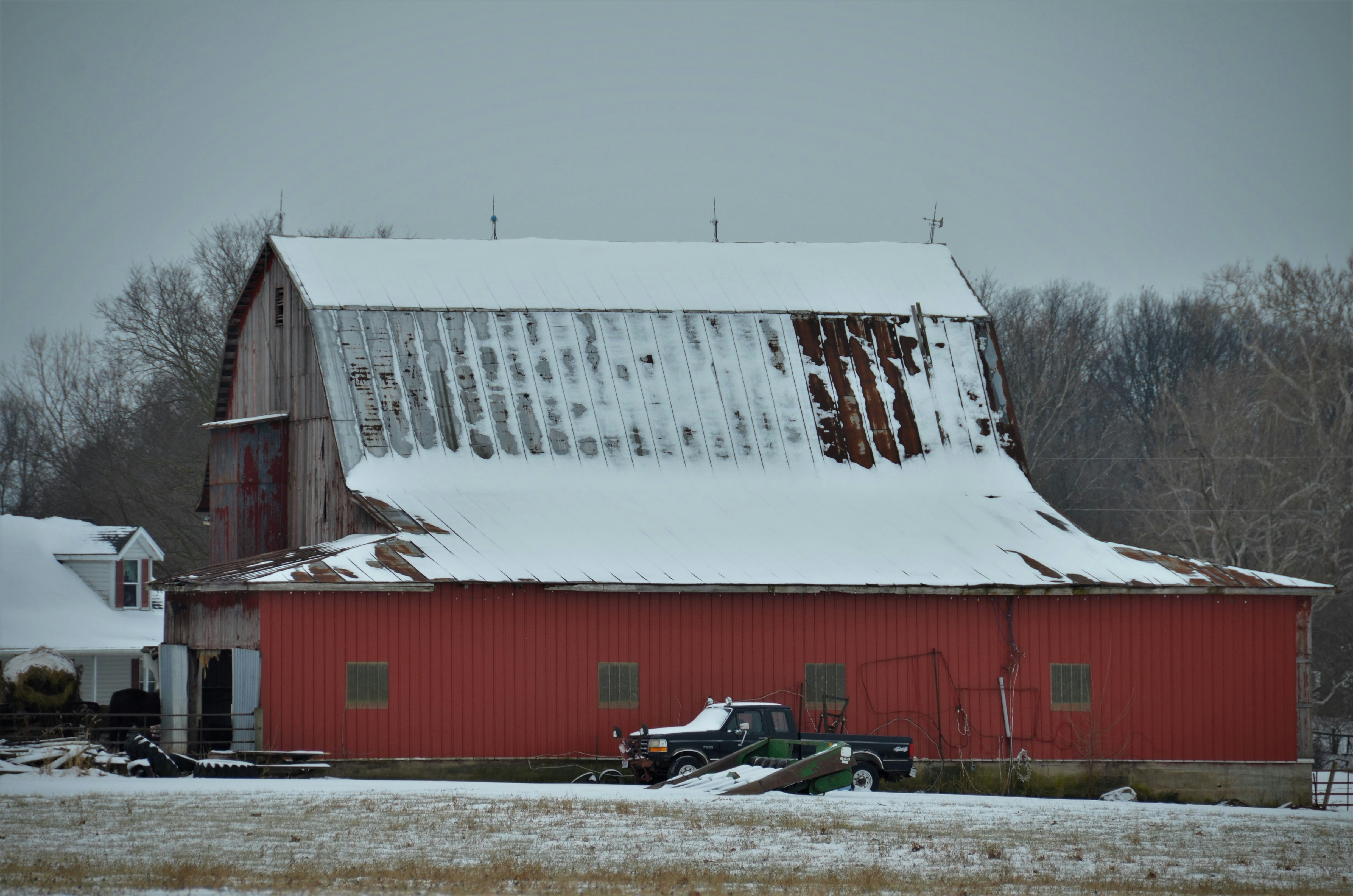 Snow easily sliding off a sleek metal roof in Rochester, NY - metal roofing rochester ny