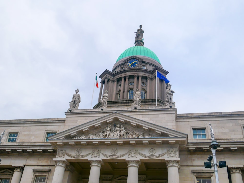 a large building with a green dome on top