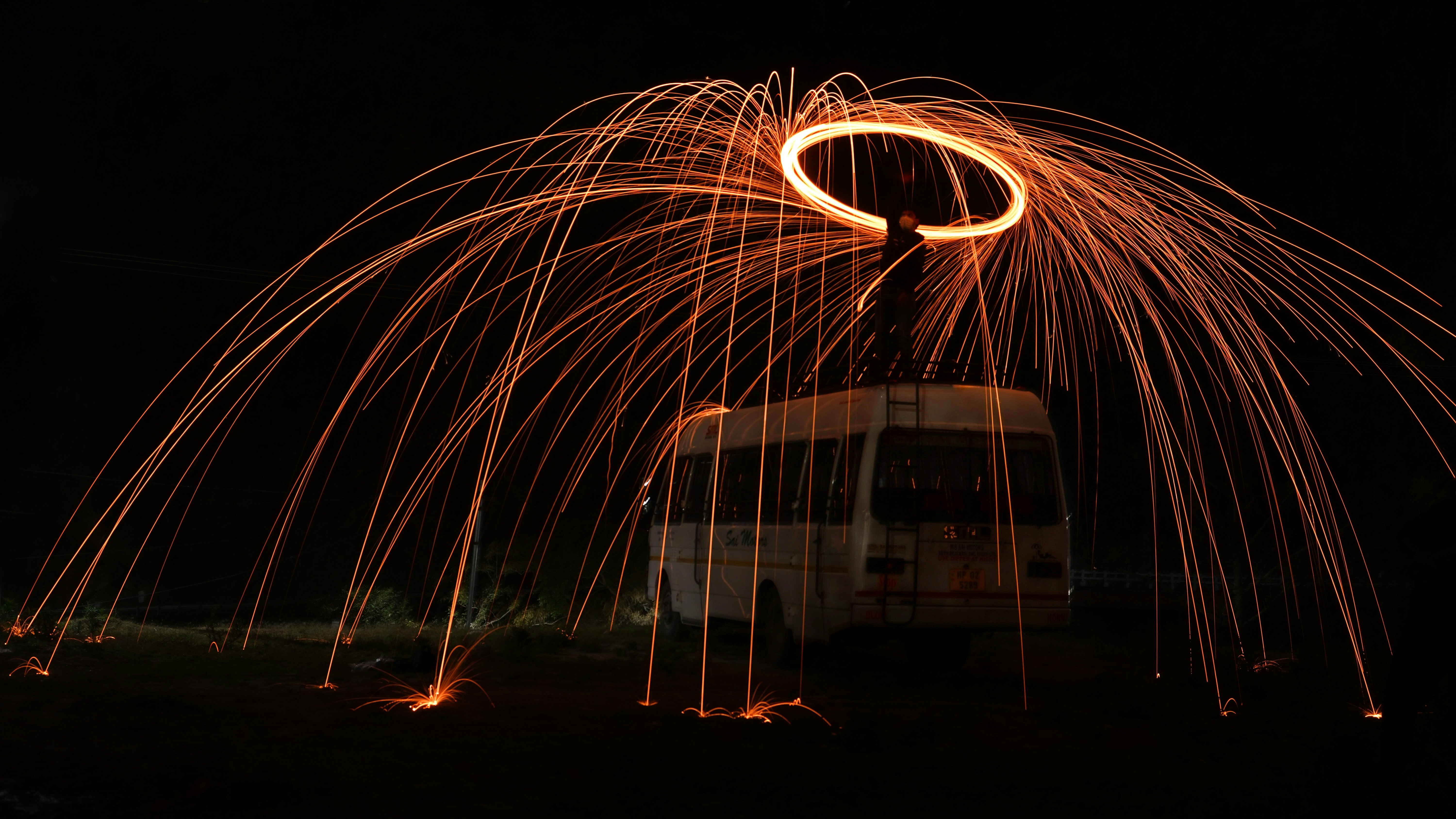 a truck driving down a street at night