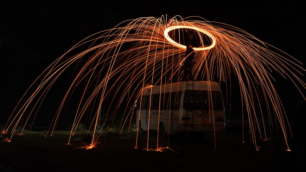 a truck driving down a street at night