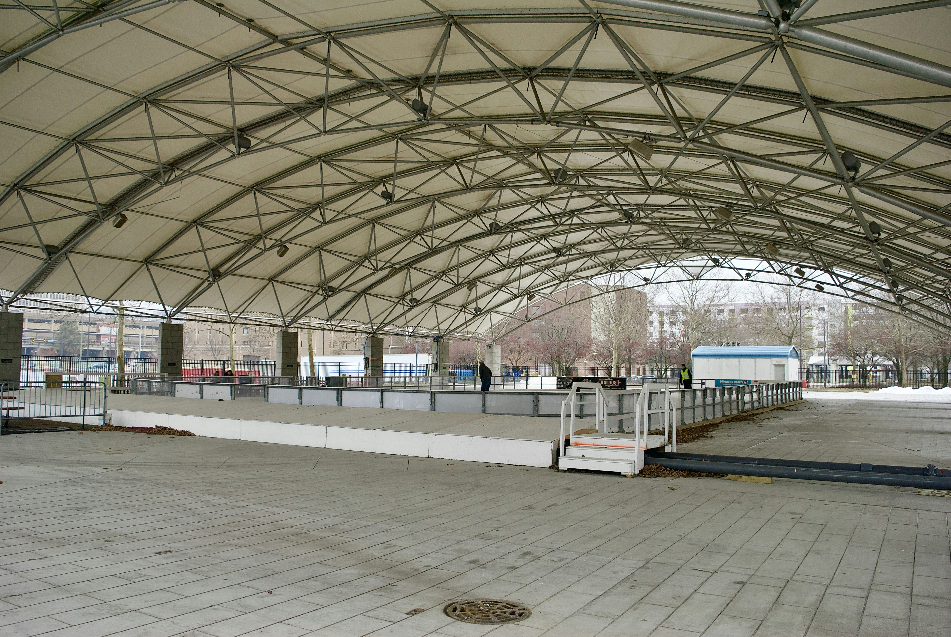 a large open area with a walkway and a fence