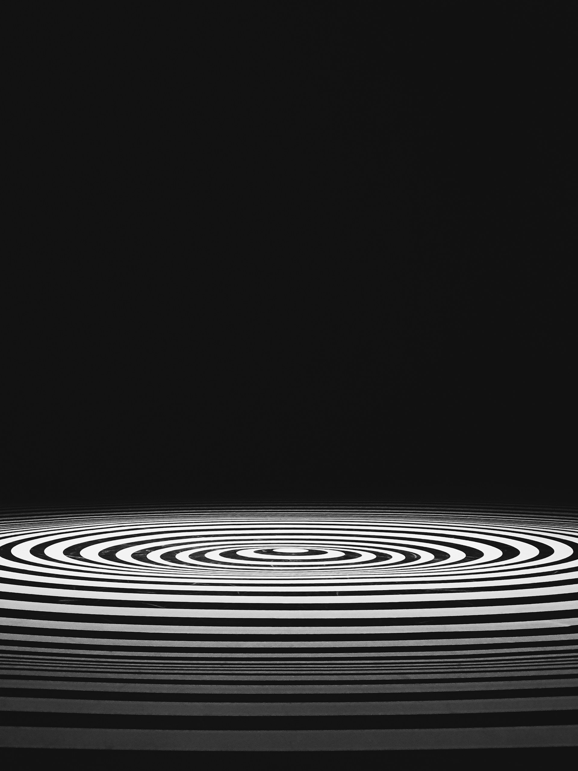 a black and white photo of a circular object