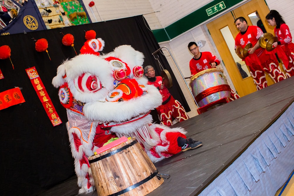 a man in a lion costume standing on a stage