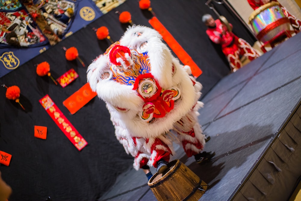 a man in a lion costume standing on a stage