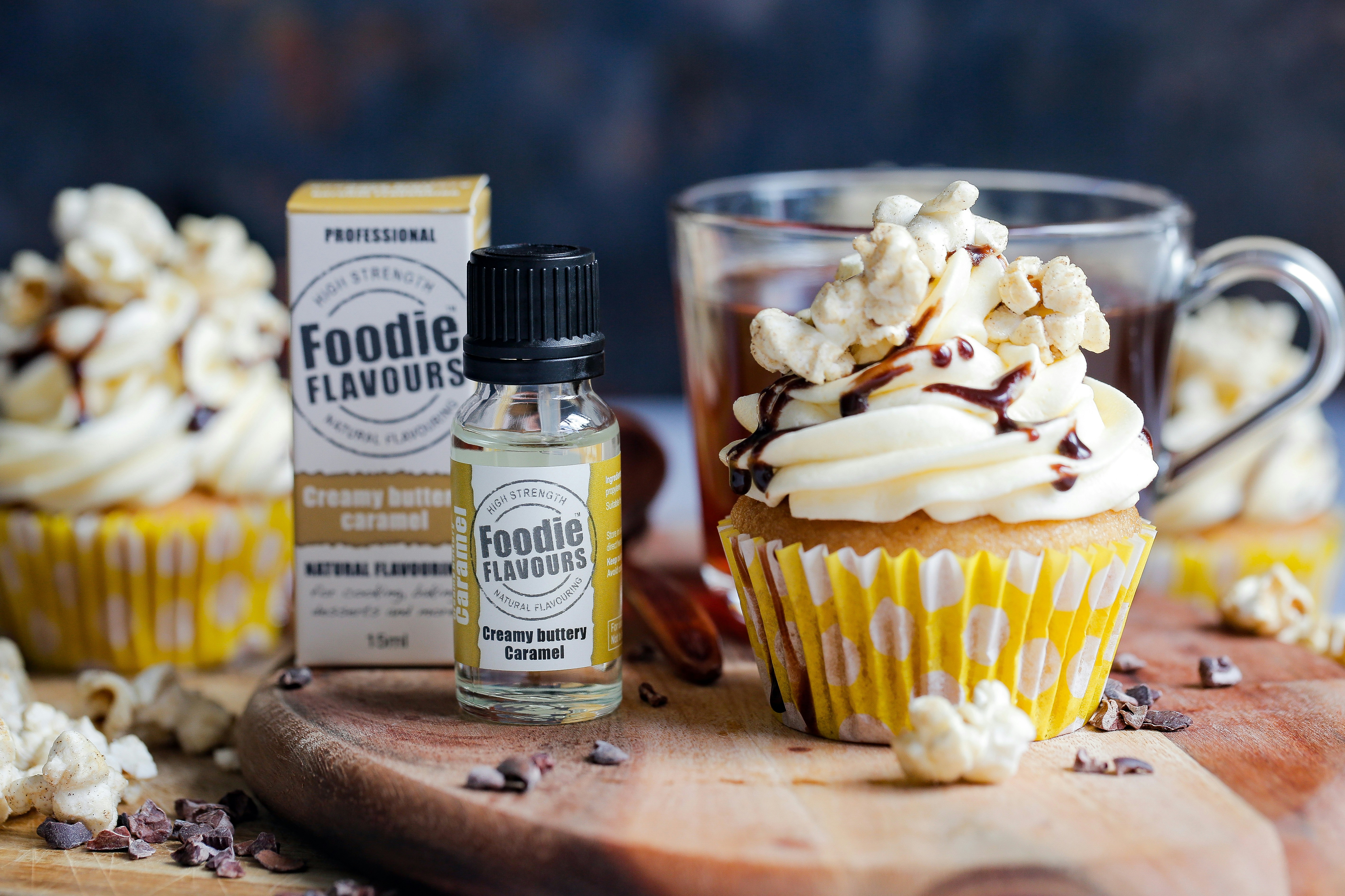 a cupcake next to a bottle of foodie flavor