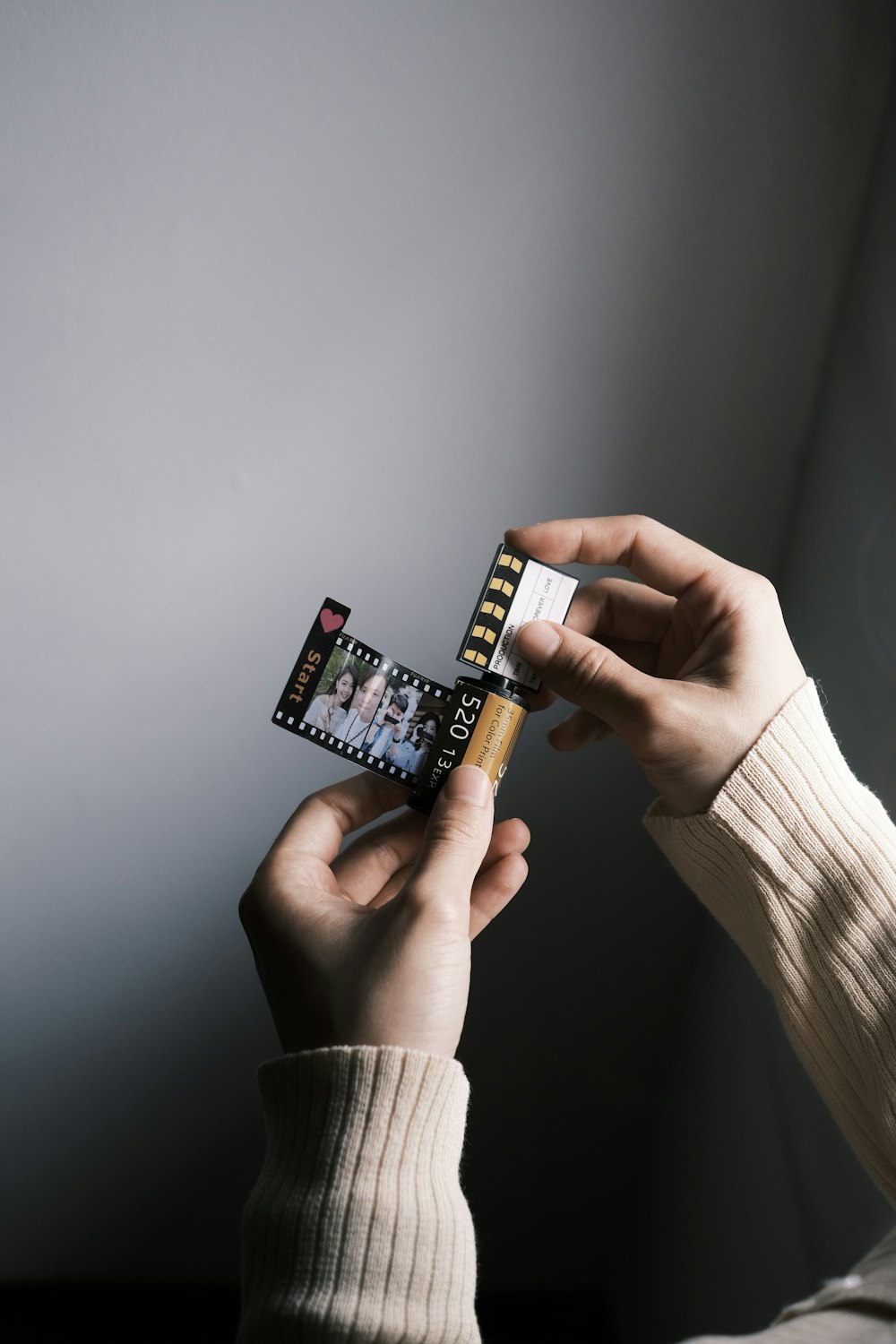 a person holding a small camera in their hand