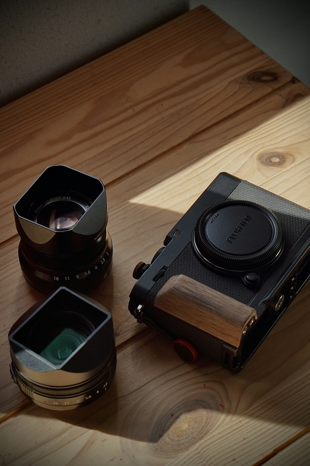 a camera sitting on top of a wooden table