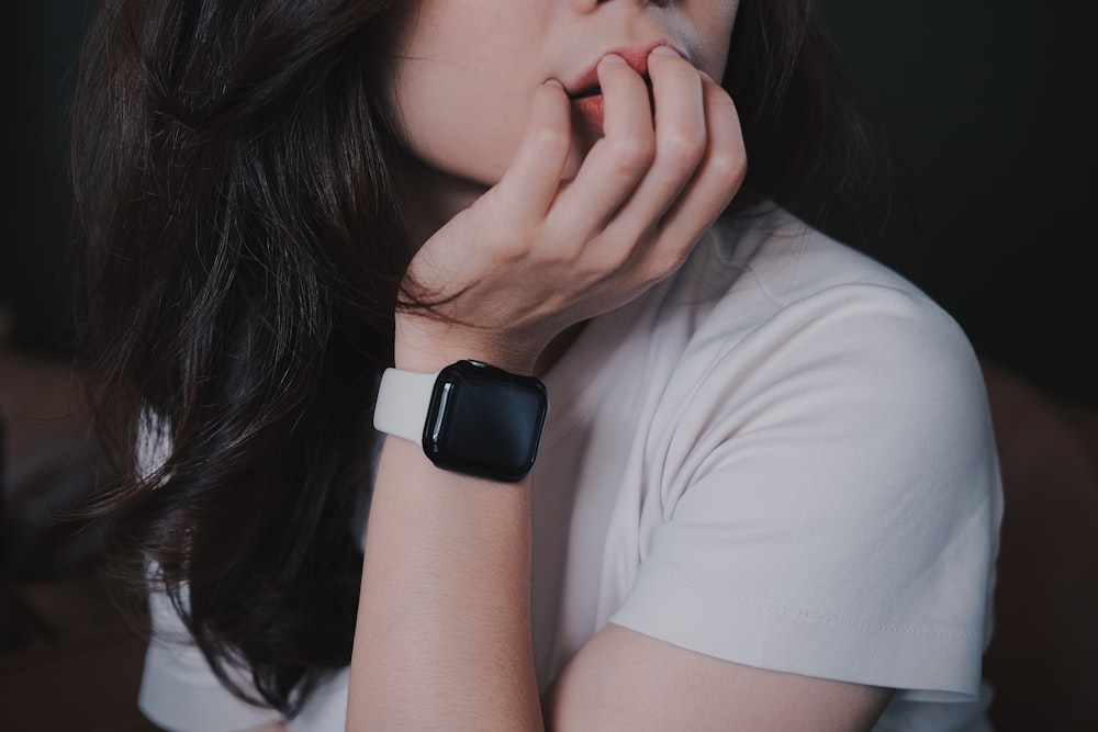 a woman with a watch on her wrist