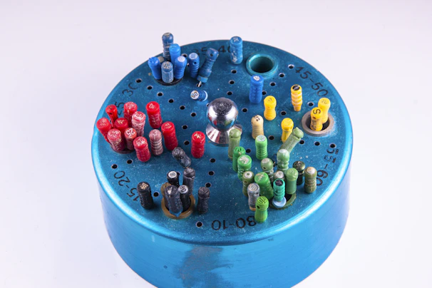 a close up of a blue container with a bunch of small objects in it