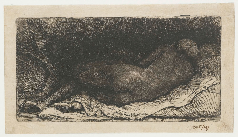 a black and white drawing of a person laying down