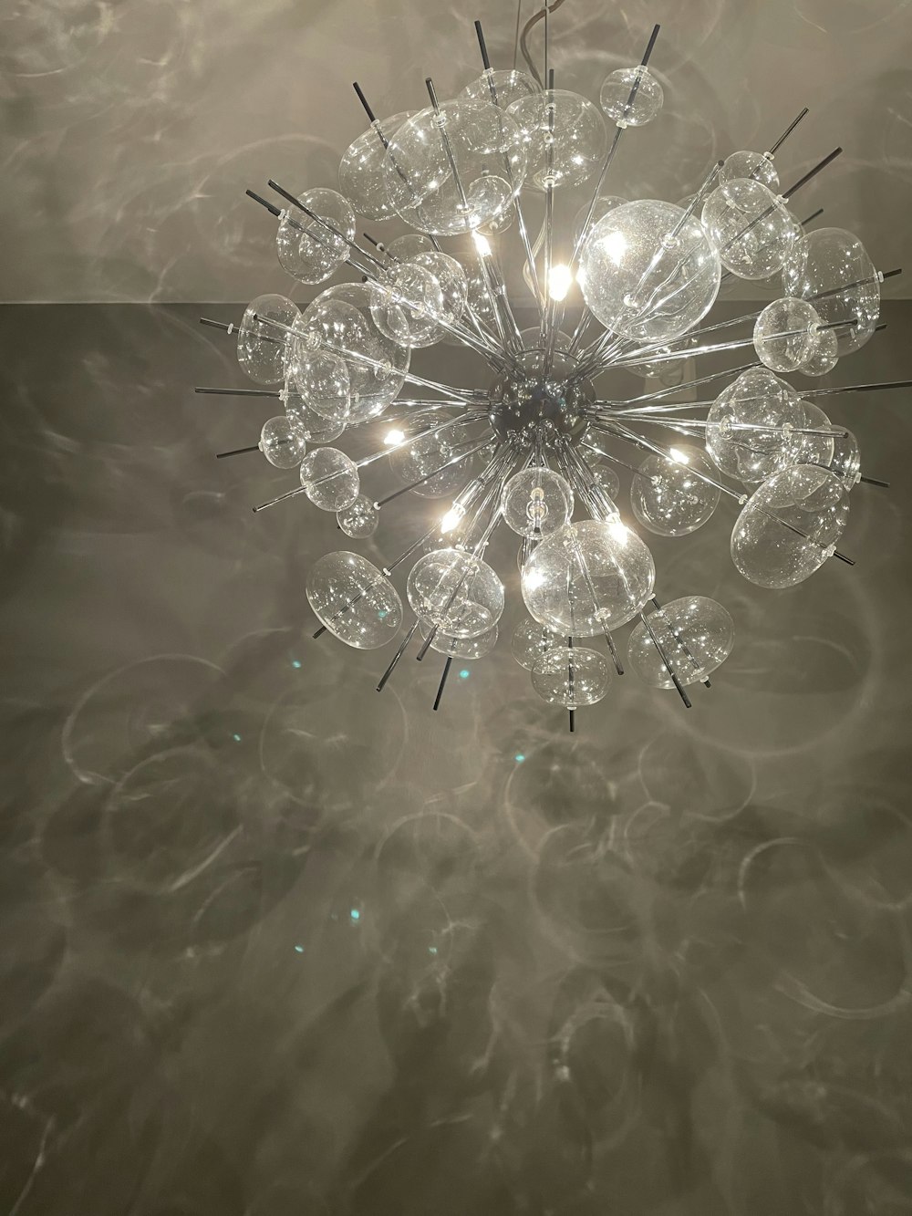 A Chandelier Hanging From Ceiling In
