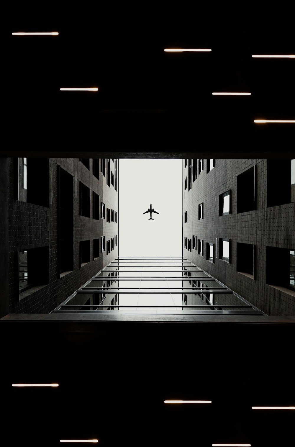an airplane is flying through a dark building