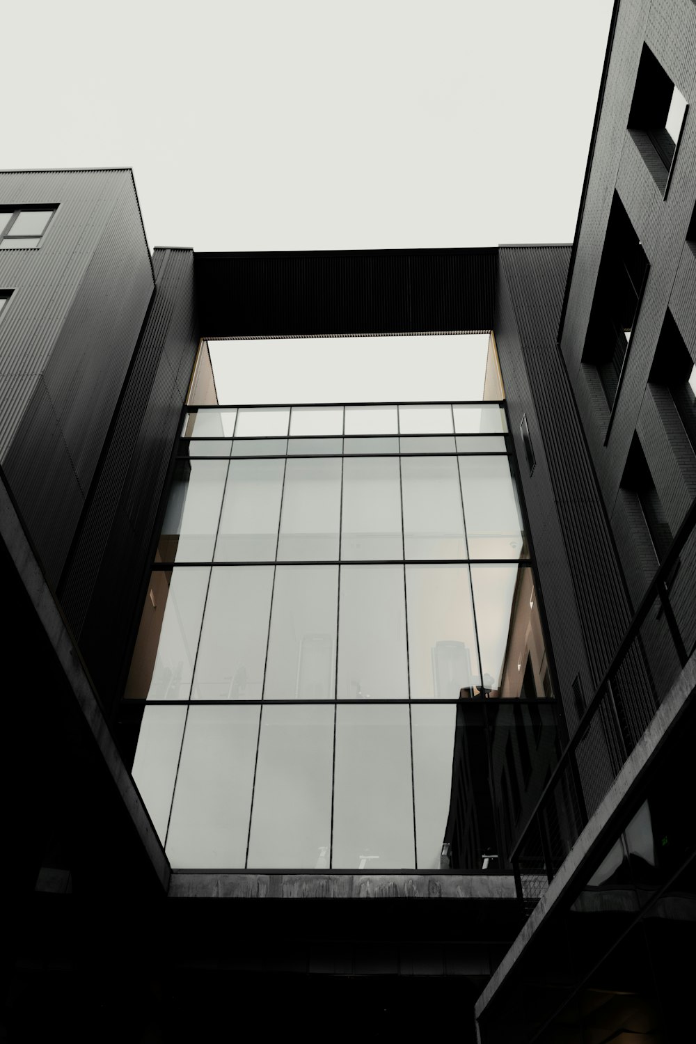 a black and white photo of two buildings