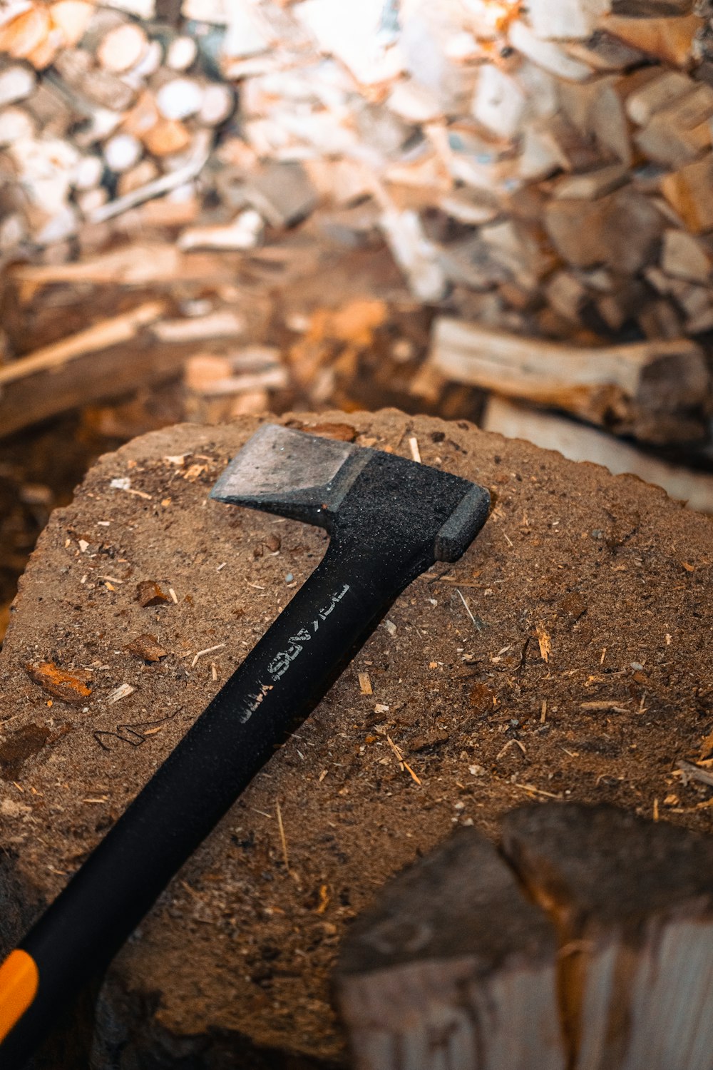 a hammer sitting on top of a pile of wood