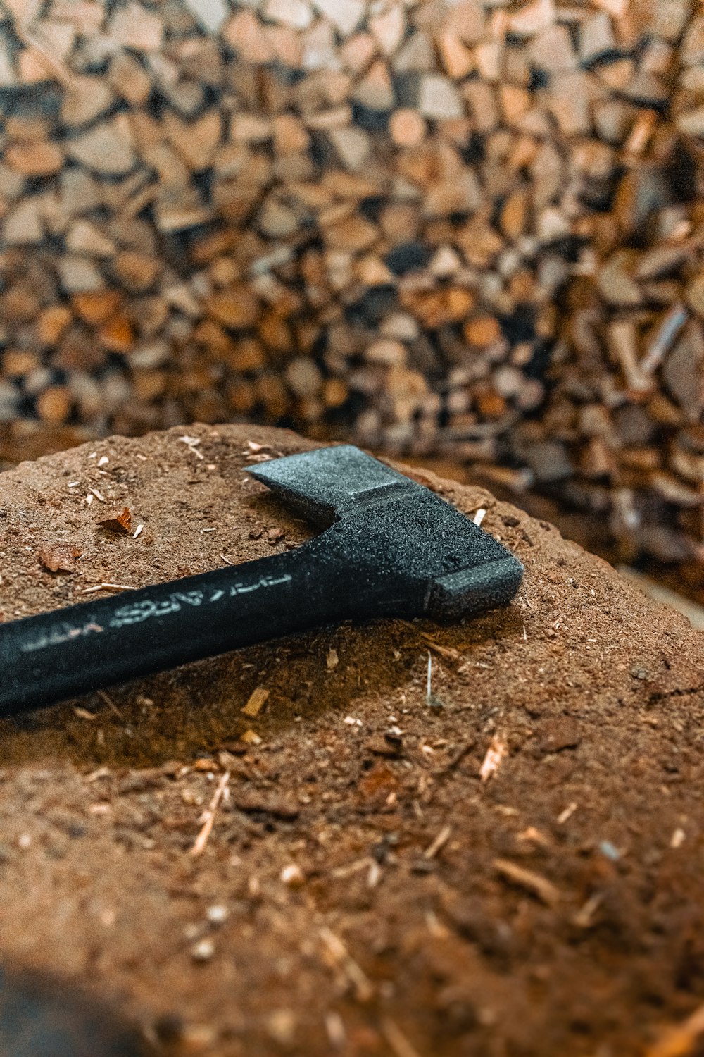 a hammer laying on top of a pile of wood