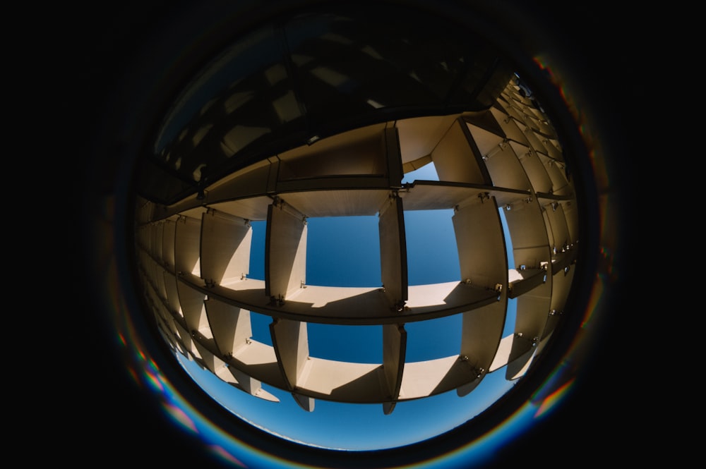 a view of the sky through a circular object