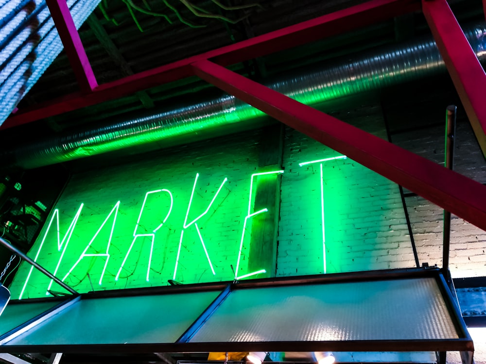 a neon sign that is on the side of a building