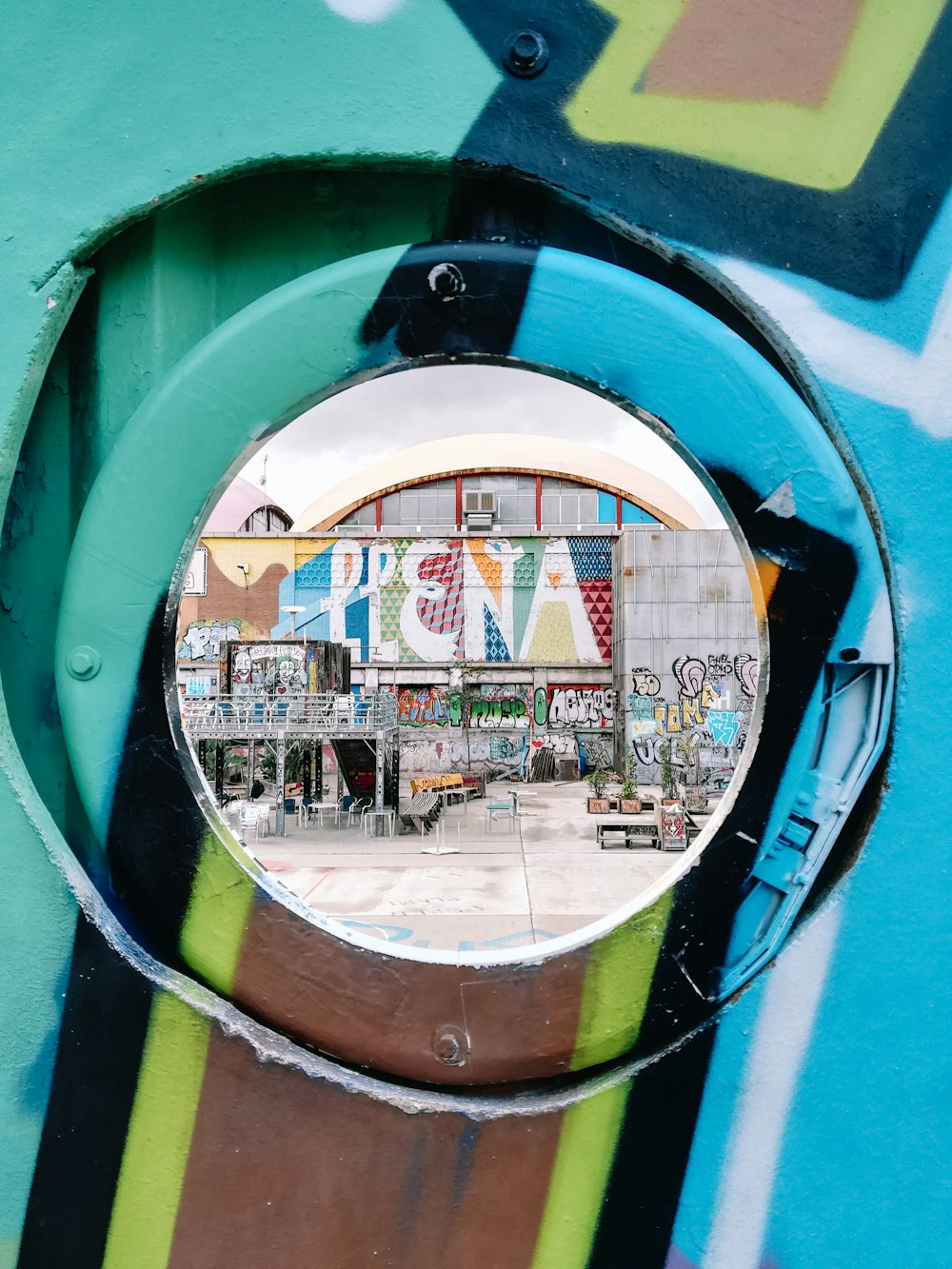 a circular mirror is shown on a wall