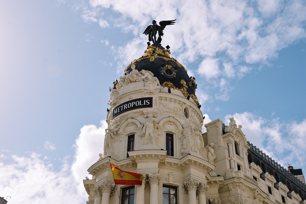 a large building with a statue on top of it