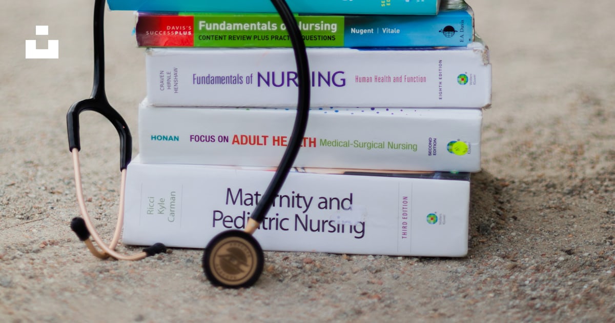 A woman's feet on a stack of books with a stethoscope photo – Free ...